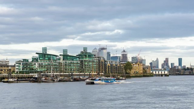 Day time luxury riverside apartment blocks of Cinnabar Wharf, Wapping. London, UK. Time lapse.