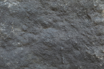 artificial backgrounds, texture of the surface of old black rubber. Background: Old rubber surface with cracks. Rubber walking ground texture