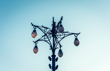Fototapeta na wymiar Old street lamppost – vintage light on streets in Catania, Sicily, Italy.