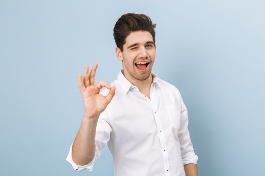Portrait of a cheerful handsome young man standing