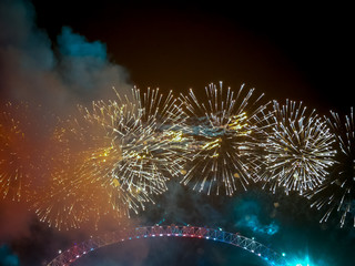 The London New year fireworks display captured from the central Barge on the River Thames