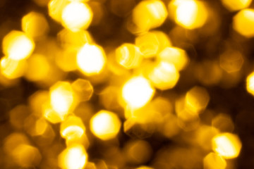 Golden glitter festive background with bokeh lights. Celebration concept for New Year, Christmas Holidays.