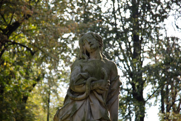 Fototapeta na wymiar Lancut castle. Statue in Park surrounding the castle