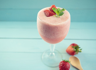 Strawberry smoothie or milkshake in glass on pastel background,which  fresh healthy food for breakfast and snack in the morning