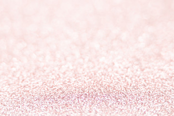 Pink glitter texture Festive sparkling sequins background closeup. Wpaper for Valentine, New Year or Christmas Holidays.