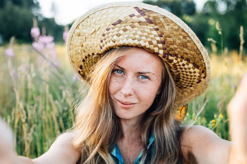 Self portrait of beautiful young blonde smiling woman