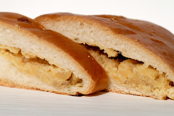 Pie stuffed with peas cut into pieces closeup. Shallow depth of field