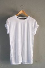 Retro fold white cotton T-Shirt clothes mock up template on gray cement background concept for...