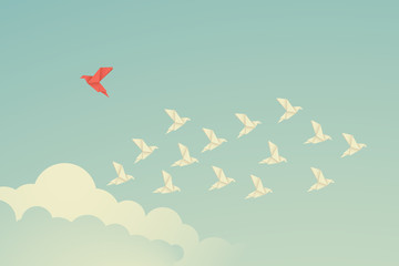 Minimalist stile red bird changing direction and white ones. New idea, change, trend, courage, creative solution,business, innovation and unique way concept
