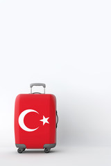 Travel suitcase with the flag of Turkey. Holiday destination. 3D Render