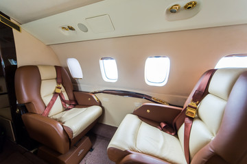 Luxury interior in bright colors in the private business jet