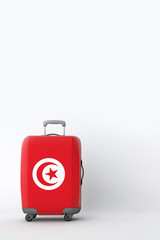 Travel suitcase with the flag of Tunisia. Holiday destination. 3D Render
