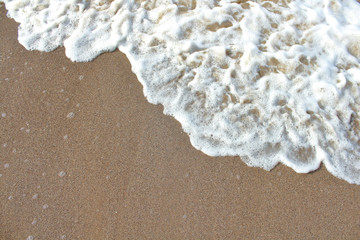 Sea and sand. Real view from above. Close-up. Background. Texture.
