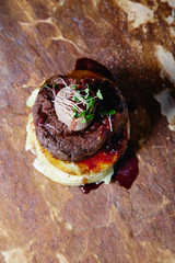 Juicy meat beef steak in a delicious restaurant serving on natural stone in a relaxed atmosphere