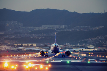 big plane landing during blue hour