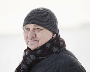 Aged man in winter field