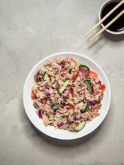 Thai Tuna Salad on the gray table. Top view. 