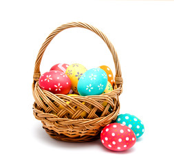 Fototapeta na wymiar Perfect colorful handmade easter eggs in the basket isolated