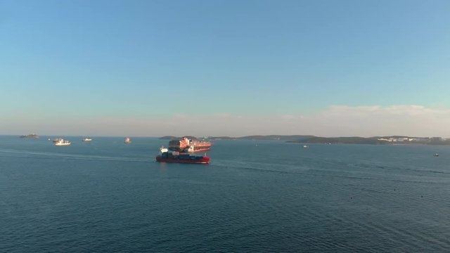 Aerial shot of two large container ships in in the bay