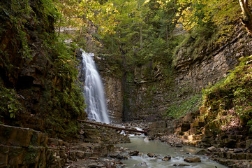 Maniavskyi waterfall in Maniava, Cascade in forest in mountains. Carpathian Mountains, Ivano-Frankivska oblast, Ukraine.