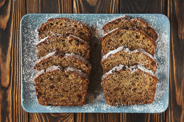 sliced homemade brown cake at blue dish