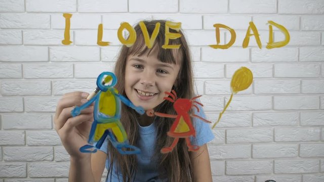 Happy daughter gives drawing dad. Love for dad. Cute little girl draws a gift for dad.