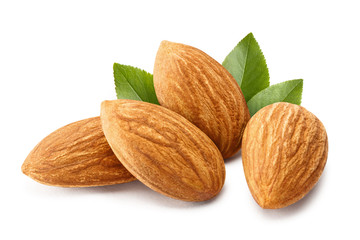 Obraz na płótnie Canvas Close-up of almonds with leaves, isolated on white background