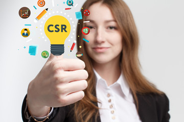 Business, technology, internet and networking concept. Young entrepreneur showing keyword: CSR