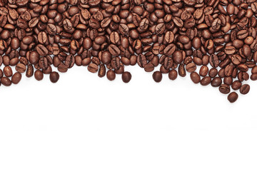 Naklejka premium Roasted coffee beans with space for text on white table background