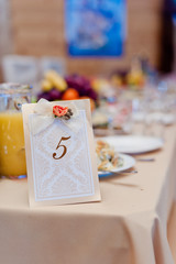 Naklejka na ściany i meble Image of a custom printed table number identifying banquet table