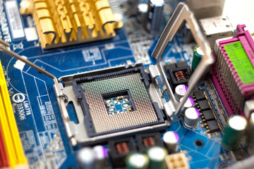 Image of a motherboard with CPU socket, heatsink and electrical components.