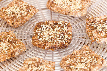 Vegan cookies are prepared on the dehydrator grid. Close up.