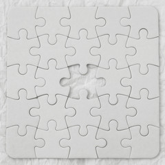 White jigsaw puzzle pieces on white background. Business concept.
