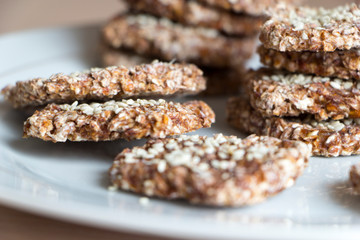 Vegan cookies from wheat and raisins on white plate