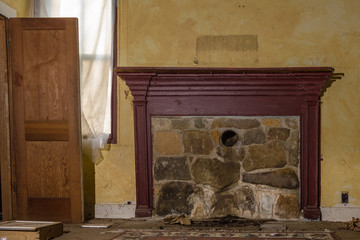 Bricked over fireplace in old abandoned farmhouse