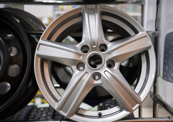 A car shop. Brand new clean white rim