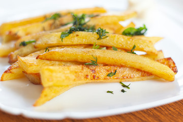 homemade fried potatoes with greens with sauce