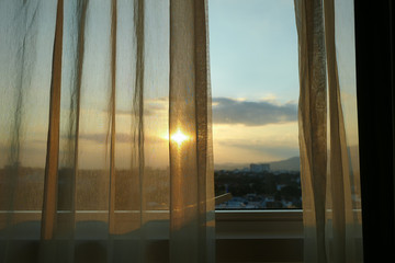 sun light through white curtain interior of window in the morning