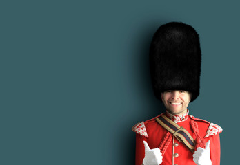 Young man in the costume of the Royal guards of Britain