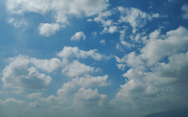 fluffy white cloud on clear blue sky