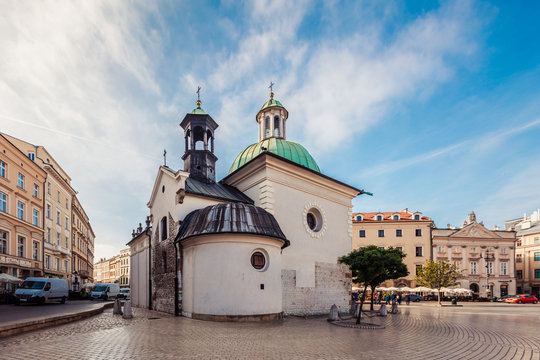  St. Wojciech's Church on Main Market Square in Krakow at dusk.