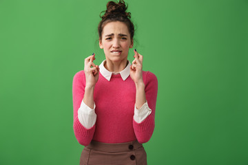 Portrait of a worried woman holding fingers