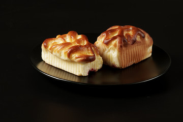 Tasty homemade pie with forest fruits on black background.
