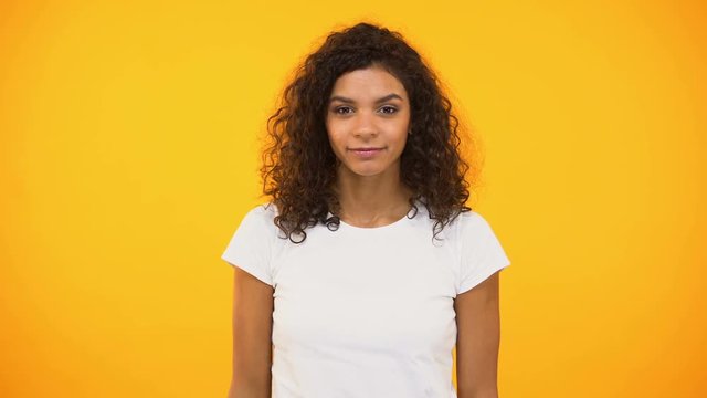 African-american female shouting to camera, trying to pay attention, opinion
