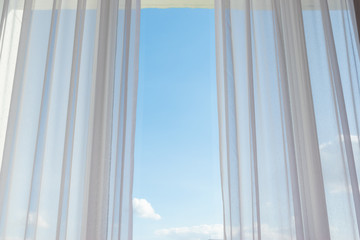 white curtain on glass window