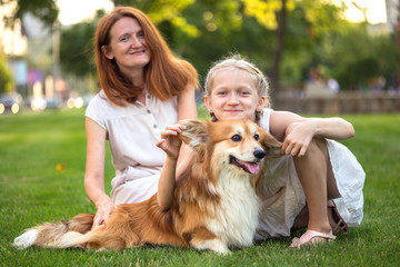 mother, daughter and dog