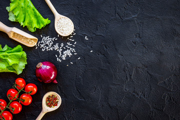 ingredients for paella on dark background top view