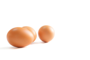 Eggs spread ramdomly on the white background