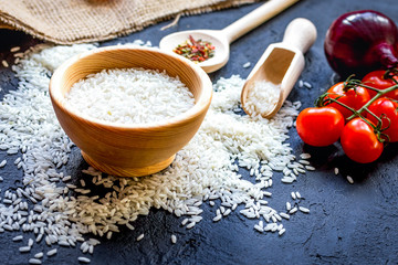 ingredients for paella on dark background