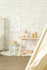 Tent, crib and kids furniture in the nursery room, nicely decorated kids room